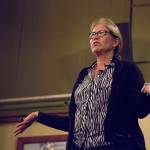 Lynne McKee, former FBI art theft leader, speaks to a packed room at McMenamins Anderson School in Bothell on Aug. 27. The event was part of the Pub Night Talks put on by the University of Washington Bothell and McMenamins. Ashley Hiruko/staff photo