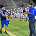 Bothells Christian Galvan receives his Cougar offensive player of the game award. Photo courtesy of Greg Nelson