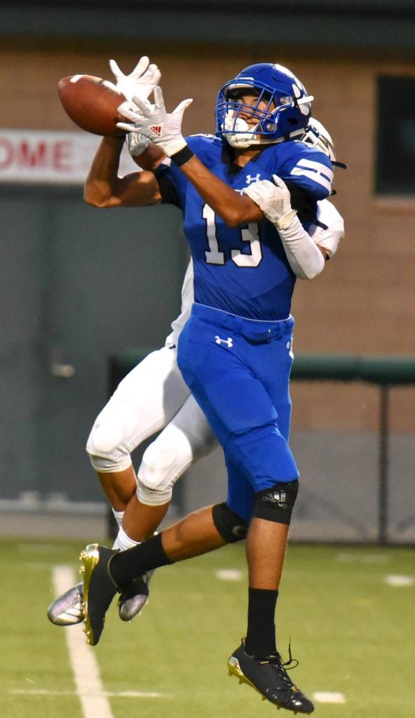 First-year Cougar Jordyn Turner hauls in a pass against Legacy. Photo courtesy of Greg Nelson