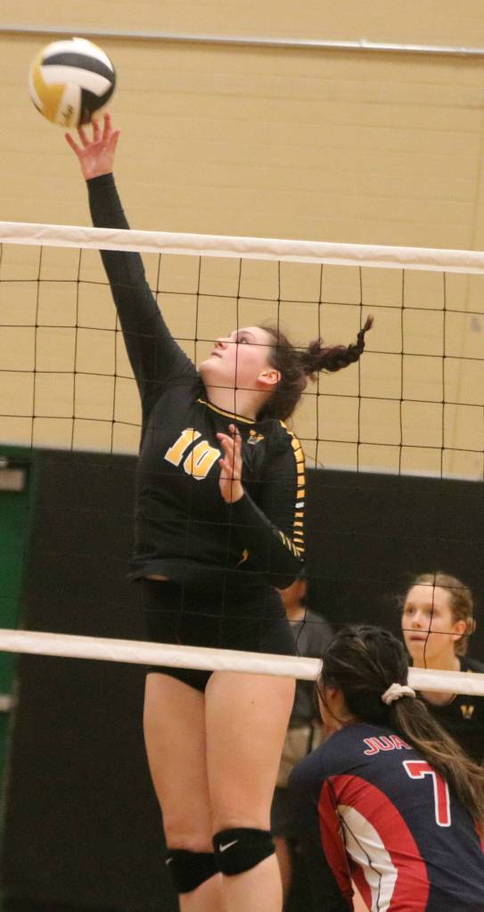 Inglemoor senior Miranda Nelson attacks the net against Juanita. Andy Nystrom/ staff photo