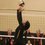 Inglemoor junior Analynn Liam sets up a teammate against Juanita. Andy Nystrom/ staff photo