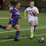 North Creeks Kaylin Gaiser (15) and Mount Sis Sydney Dunn (19) approach the ball on Oct. 1. Andy Nystrom/ staff photo