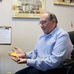 Stephanie Quiroz/staff photo                                 Paul Brown looks at his Be Kind bell he received following the Marysville Pilchuck High School shooting.