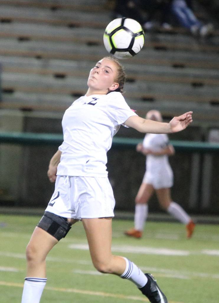 Inglemoors Olivia Levy gets her head on the ball. Andy Nystrom/ staff photo