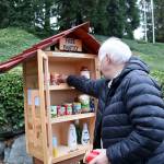 Stephanie Quiroz/staff photo                                Rick Heinbaugh fills the new community pantry on Oct. 22.