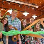 Staff and management of The Evergreen Markets fifth and newest store, in Bellevue, celebrate the locations grand opening in August.
