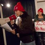 Gabriela Arias leads a group of Canyon Creek Estates tenants through a chant on Friday, Nov. 15. They said their concerns have gone unaddressed. Ashley Hiruko/staff photo