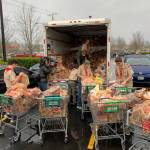 Members of Boy Scouts troop 622 sort through food donations. Photo courtesy of of Boy Scouts Troop 622
