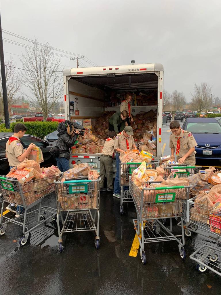 Members of Boy Scouts troop 622 sort through food donations. Photo courtesy of of Boy Scouts Troop 622