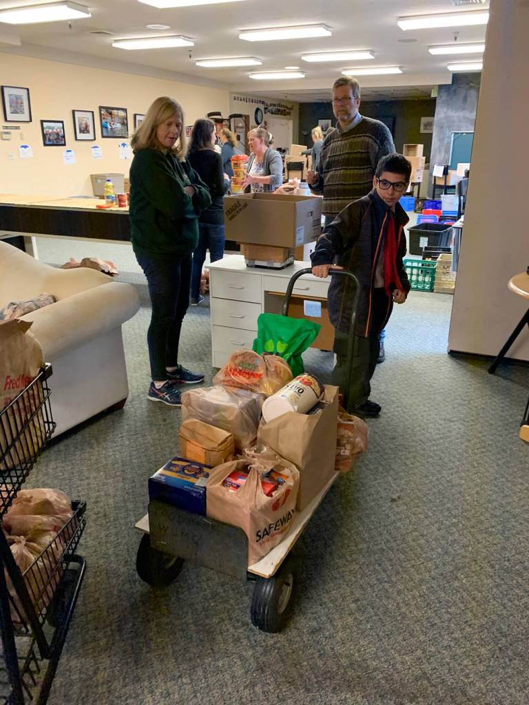 Boy scouts representing Troop 622 collected donations at the entrances of the Bothell Fred Meyer from Nov.14-16. The scouts collected 5,608 pounds of non-perishable food donations and $536 in cash donations. Photo courtesy of of Boy Scouts Troop 622
