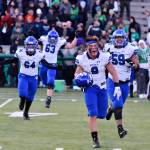 Bothells Tala Tevaga (9) leads the way to the Cougar celebration in the grandstands with Christopher Bailey (64), Luka Vincic (63) and Malik Said (59) on Saturday at Pop Keeney Stadium. Bothell beat Woodinville, 31-21, in the semifinals and advances to the 4A state final. Photo courtesy of Greg Nelson