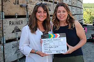 Courtesy photo                                 Victoria Breckwich Vásquez and Jody Early on the set of the ¡Basta! video in the Yakima Valley in August.