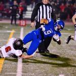 Tala Tevaga lunges for some extra yardage as Camas Dante Humble grabs on for the ride. Photo courtesy of Greg Nelson