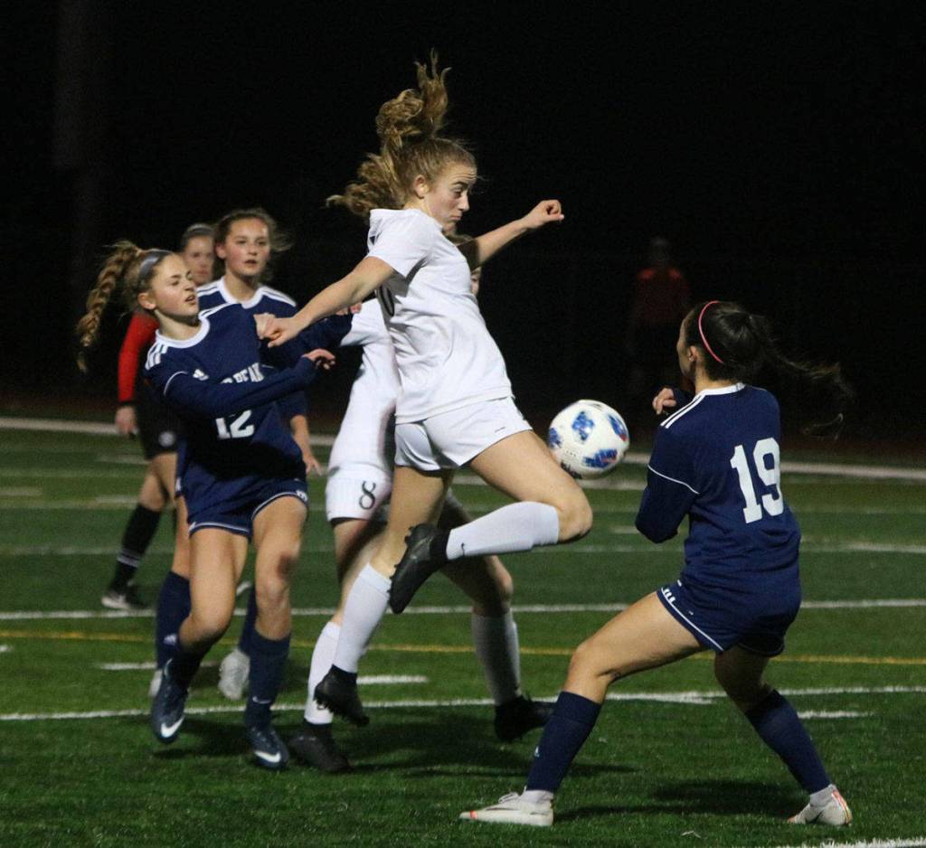 Inglemoors Julia Monson (middle) fights for the ball against Glacier Peak in the 4A Wes-King District title match. Andy Nystrom/ staff photo