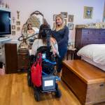 Lindsey Holland, a nurse, talks with Loa Griesbach about what makeup she wants. (Olivia Vanni / Everett Herald)