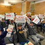 Photo courtesy of Danny Howe                                North Lake Little Leaguers hold up signs to encourage Kenmore City Council members to support continuing progress on possible ball fields at St. Edward State Park.