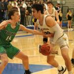 Woodinvilles Ryan Roth, left, defends Inglemoors Peter Hansen on Feb. 18. Andy Nystrom/ staff photo