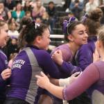 North Creek gymnast Giovanna Calozza celebrates with her teammates after a bar routine during the 4A gymnastics state meet on Feb. 21 at Sammamish High School. Benjamin Olson/staff photo