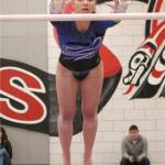 Bothells Cora Taylor finished first on bars during the event finals at the 4A state gymnastics meet, scoring a 37.075 on Feb. 22 at Sammamish High School. This was the second straight year that Taylor finished first on bars. Benjamin Olson/staff photo