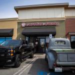 Customers pick up their orders at Carolina Smoke in Bothell. Olivia Vanni/staff photo