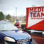 A volunteer screens a potential patient before they are admitted to one of Medical Teams Internationals emergency dental clinic. Photo courtesy of Medical Teams International