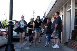 A few people wear face masks when the city of Enumclaw recently had a downtown cruise where people drove around downtown to order food from local restaurants. RAY MILLER-STILL, Enumclaw Courier-Herald