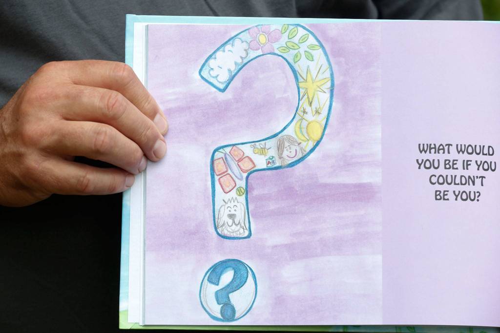The final page of What Would I Be If I Couldnt Be Me features granddaughter Abbys favorite picture in the book. (Kevin Clark / The Herald)