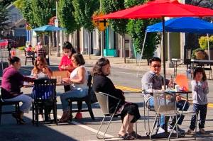 In Phase 2 of Gov. Jay Inslees reopening plan, which was announced Jan. 28, restaurants can reopen at a maximum 25% capacity and a limit of six people per table. Inslee recently announced all counties will be staying in Phase 2 of the states reopening plan for the next several weeks. Pictured: People enjoy outdoor dining last summer in downtown Kent. Courtesy photo