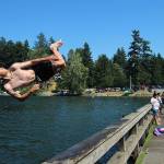Fedor Osipov, 15, flips into Steel Lake in Federal Way on June 28. Olivia Sullivan/Sound Publishing