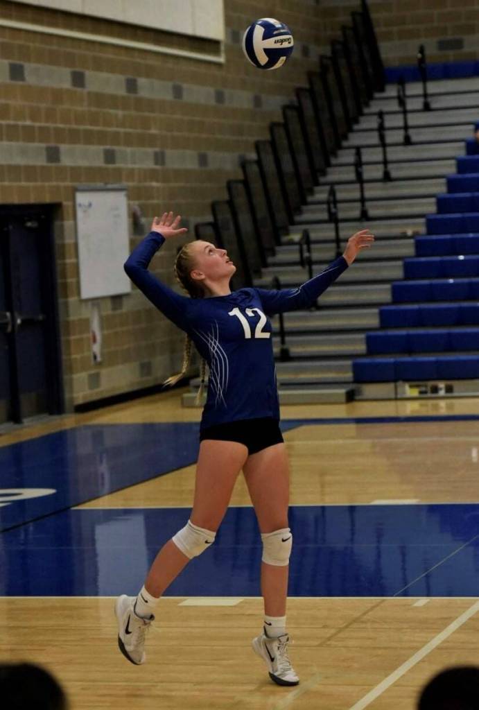 Jenna Legault serves during a game. Courtesy of Jenna Legault.