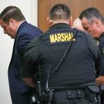 Auburn Police Officer Jeffrey Nelson is taken into custody after two guilty verdicts were handed down by the jury Thursday, June 27, at the King County Maleng Regional Justice Center in Kent. (Ken Lambert / The Seattle Times / Pool)