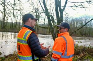 King County Flood Patrol members Thomas Bannister (left) and Seth Ballhorn on their patrol route, Dec. 9, 2025. (Grace Gorenflo/Sound Publishing)