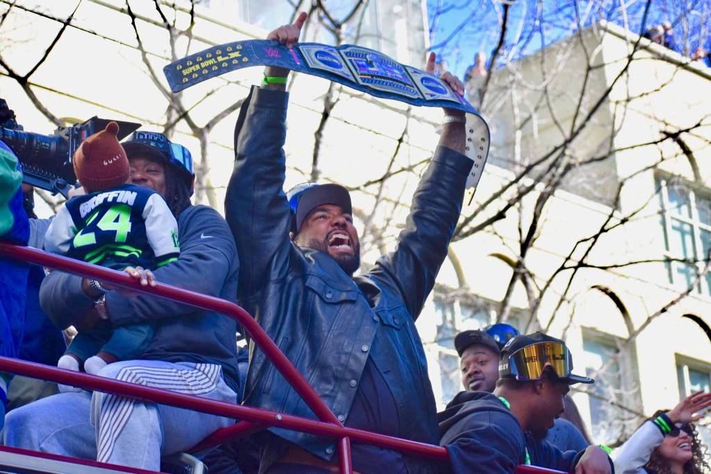Seahawks defensive lineman Leonard Williams holds up a championship belt. Photos by Ben Ray / Sound Publishing