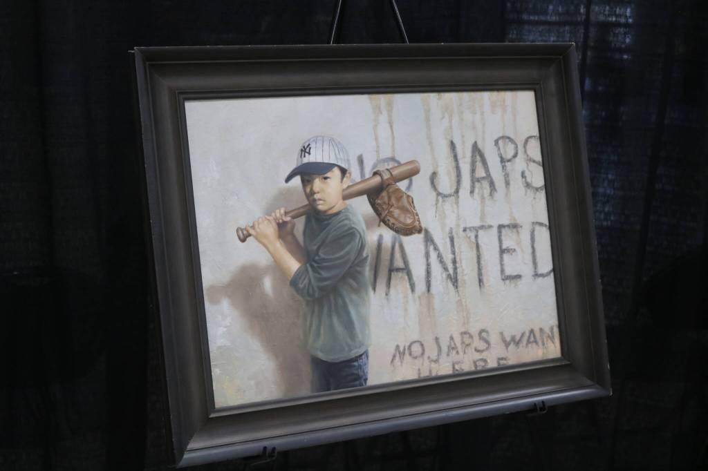 A painting by Chris Hopkins depicts incarceration from a childs perspective, balancing recreation and the experience of racism during WWII. Photo by Bailey Jo Josie/Sound Publishing