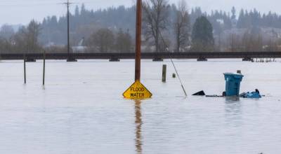 Floodwater from the Snohomish River partially covers a flood water sign along Lincoln Avenue on Thursday, Dec. 11, 2025 in Snohomish, Washington. File photo/Sound Publishing