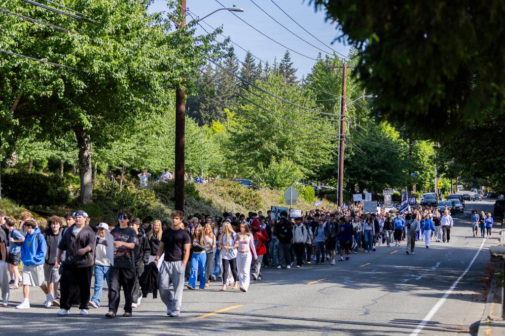More than 200 students walk out of Bothell High School in protest of the school boards vote to not renew the contract for their school resource officer on Monday, May 18, 2026, in Bothell, Washington. (Olivia Vanni / The Herald)