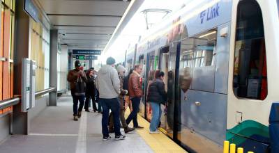 Many public transportation options are available for those looking to avoid street traffic during the World Cup. Pictured: Crowds board the Sound Transit Link Light Rail at Star Lake station. File photo