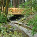 Pictured here is the bridge over Little Mission Creek that leads to a short trail system. Photo courtesy Washington State Parks and Recreation
