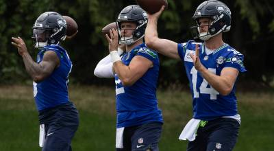 Quarterbacks Jalen Milroe, Drew Lock and Sam Darnold warm up for the Seahawks during training camp July 28 at the Virginia Mason Athletic Complex in Renton. Photo provided by Maria Dorsten