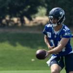Sam Darnold hands the ball off during training camp. Photo provided by Maria Dorsten